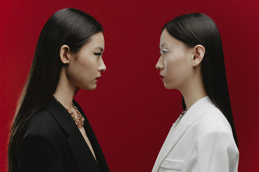 gold hoop earrings with a twisted chain design, shiny polished finish, modern fashion style