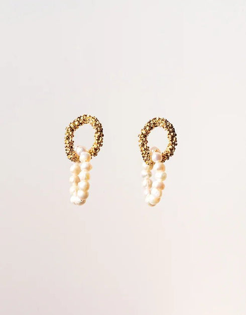 Gold textured hoop drop earrings with white freshwater pearl accents, elegant and modern style