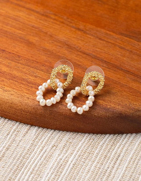 Gold textured pierced stud earrings with linked oval hoop of white freshwater pearls, elegant fashion jewelry