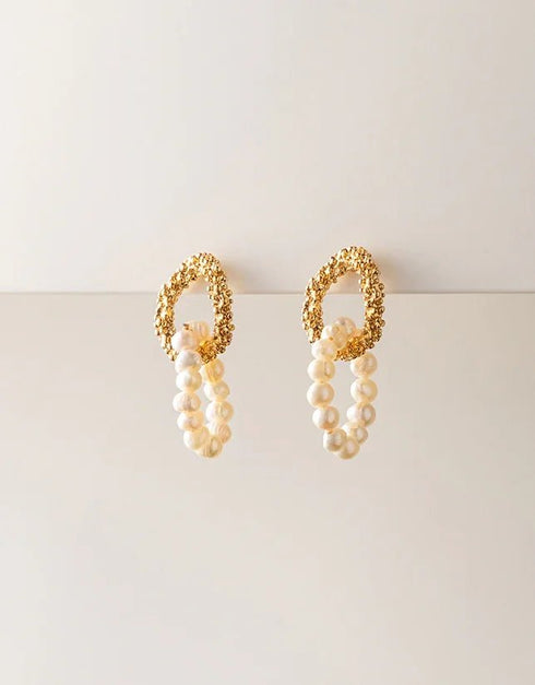 Gold textured loop drop earrings with cream pearl bead oval dangles, elegant contemporary style