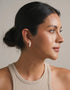 Elegant trio pearl drop earrings in white with gold finish, classic and minimalist style for pierced ears