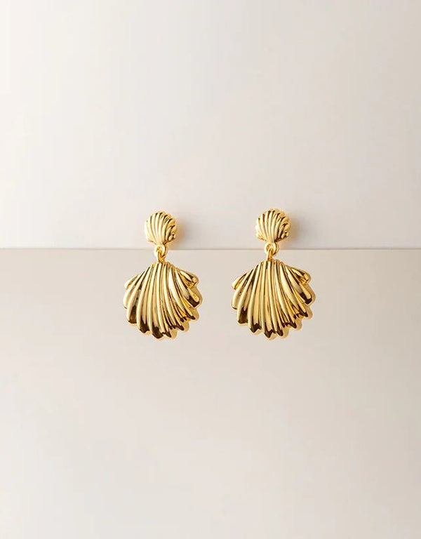 gold pierced drop earrings with shiny scallop shell design, polished finish, elegant beach style