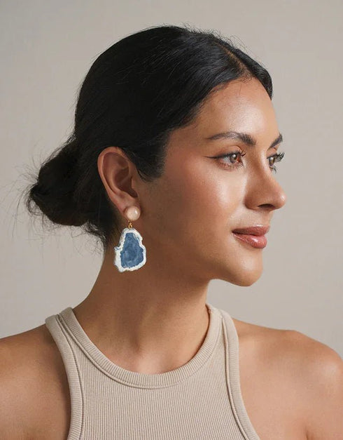 Gold drop earrings with white pearl studs and irregular blue geode stone pendants, elegant boho style