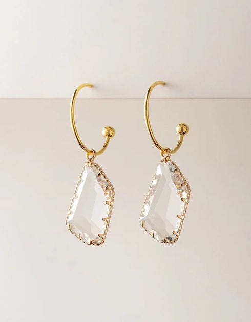 Gold-plated hoop earrings with clear faceted geometric crystal drops, elegant and modern style