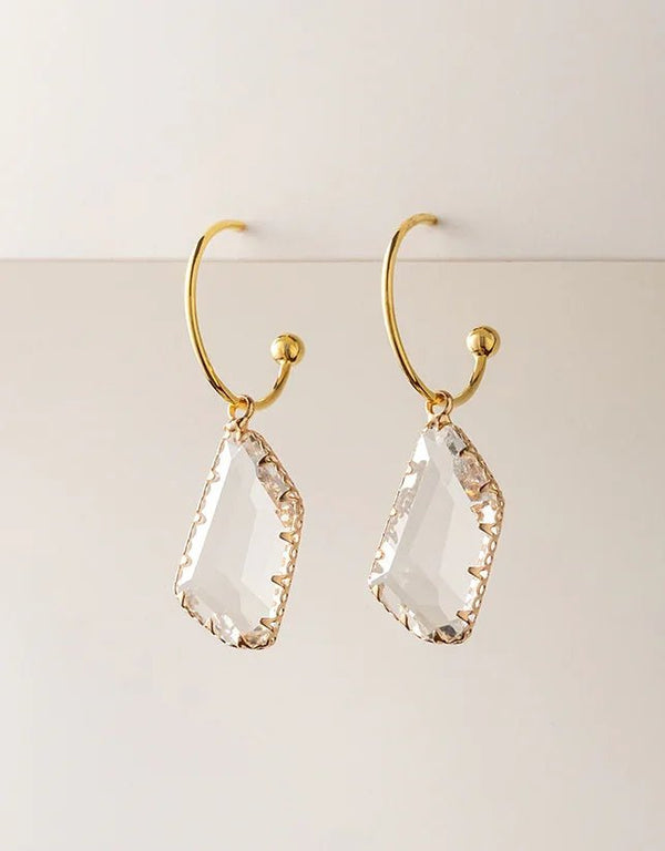 Gold-plated hoop earrings with clear faceted geometric crystal drops, elegant and modern style