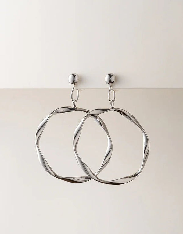silver twisted hoop earrings with polished finish and round stud backings, modern fashion accessory